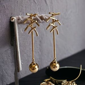 Aura Elegant Gold color earrings for women and girls.